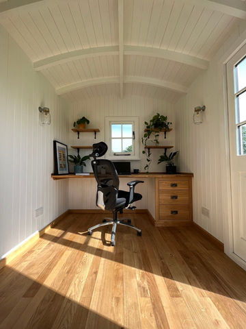 A stylish home office setup with a desk and chair, crafted by Hartwood Oak in Berkshire.