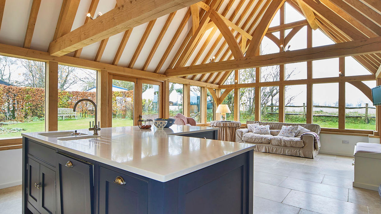 Bright living room with kitchen and dining space, part of an oak kitchen extension porch in Plastow Green by Hartwood Oak.