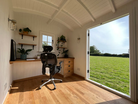 A cozy oak home office featuring a desk and chair, beautifully built by Hartwood Oak in Berkshire.