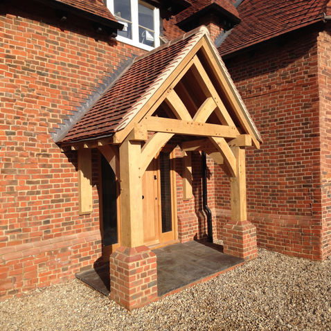 Beautiful oak porch extension by Hartwood Oak in Berkshire, featuring a sturdy timber frame and elegant design.