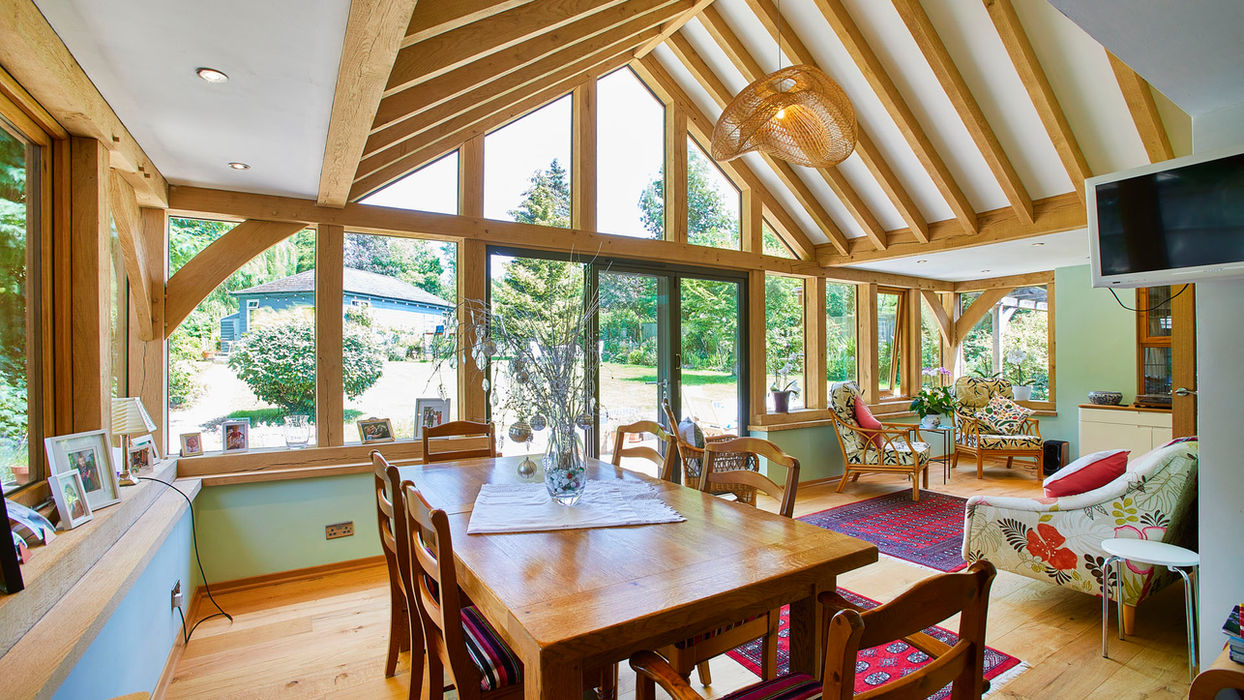 Bright living room with a wooden table and chairs, showcasing the Hartwood Oak garage workshop in Southampton.