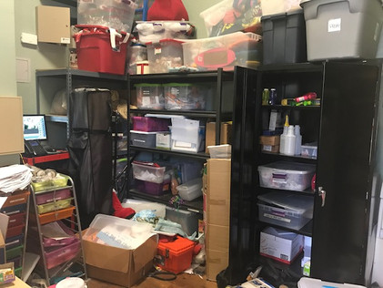 Before: Office Storage area is hard to use. There are boxes and organizational tools everywhere. There are obstacles in the way of getting to the main shelving unit.