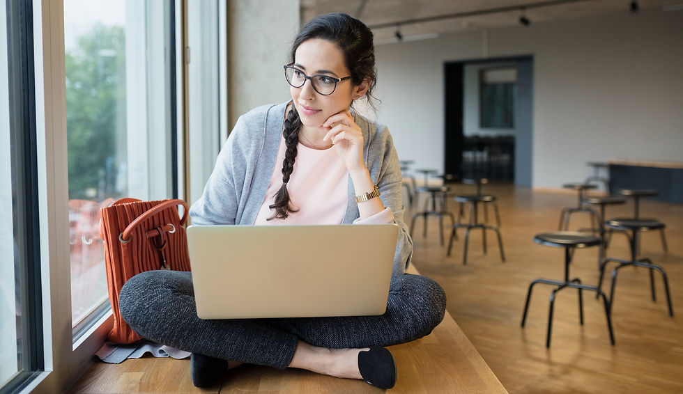 woman with laptop considering "why hire a wix expert?"