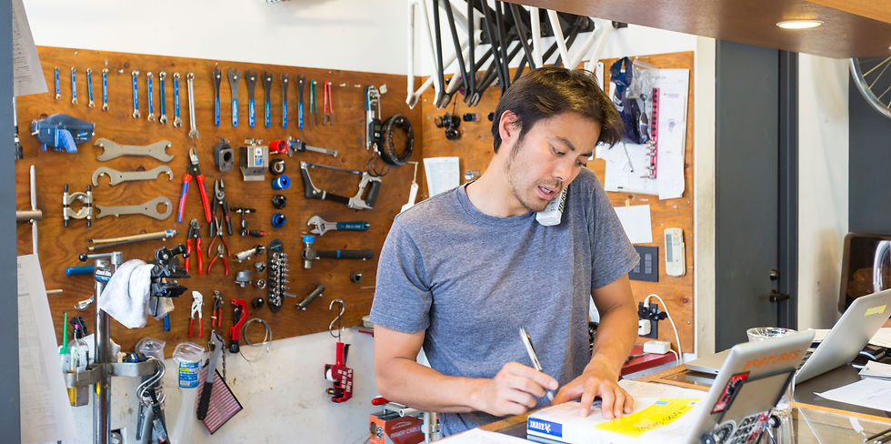 bike repair shop owner working on website
