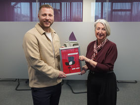 Shane Young from Barnsley & Rotherham Chamber presenting Patron Certificate to Linda Spencer from Professional Energy People