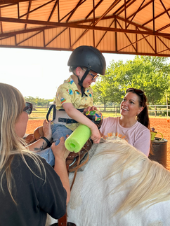 Terry working with a special needs child on a horse