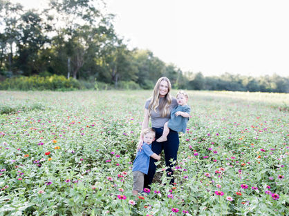MOM AND BABIES IN FLOWER FIELD