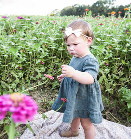TODDLER GIRL WITH FLOWERS