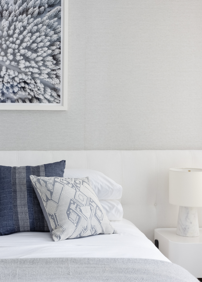 Serene Cool White Guest Room with Lacquered Nightstand and Wallpaper (Dalier Studio)