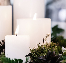 White Candles with Plant Decor