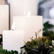 White Candles with Plant Decor