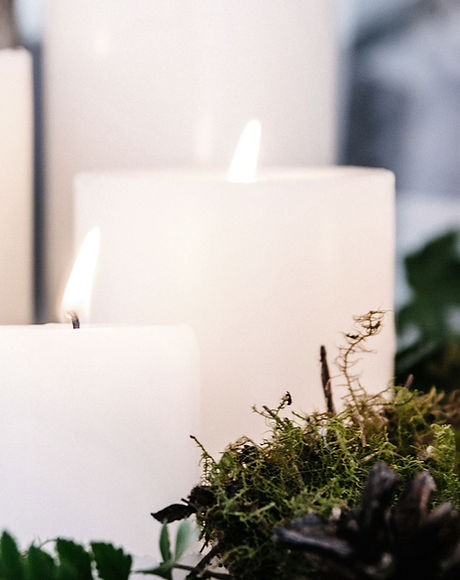 White Candles with Plant Decor
