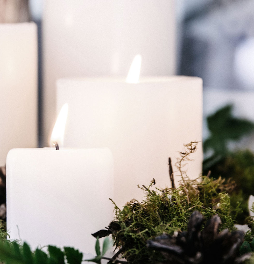 White Candles with Plant Decor