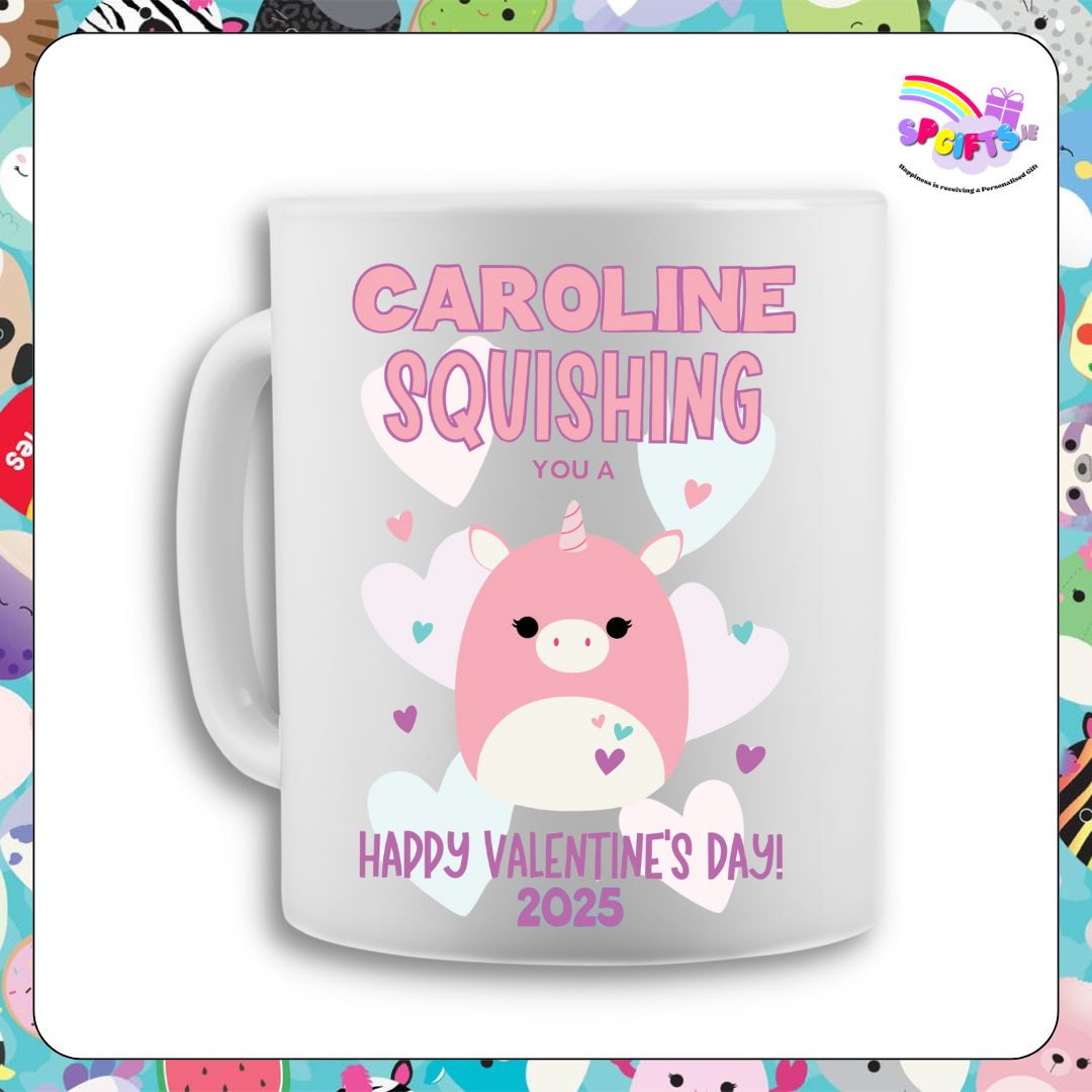 A white personalised mug featuring a pastel pink unicorn Squish design with hearts
