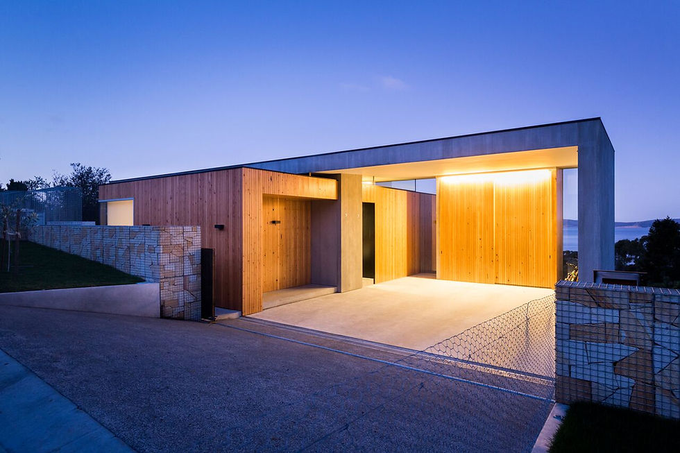 Modern residential home construction at dusk.