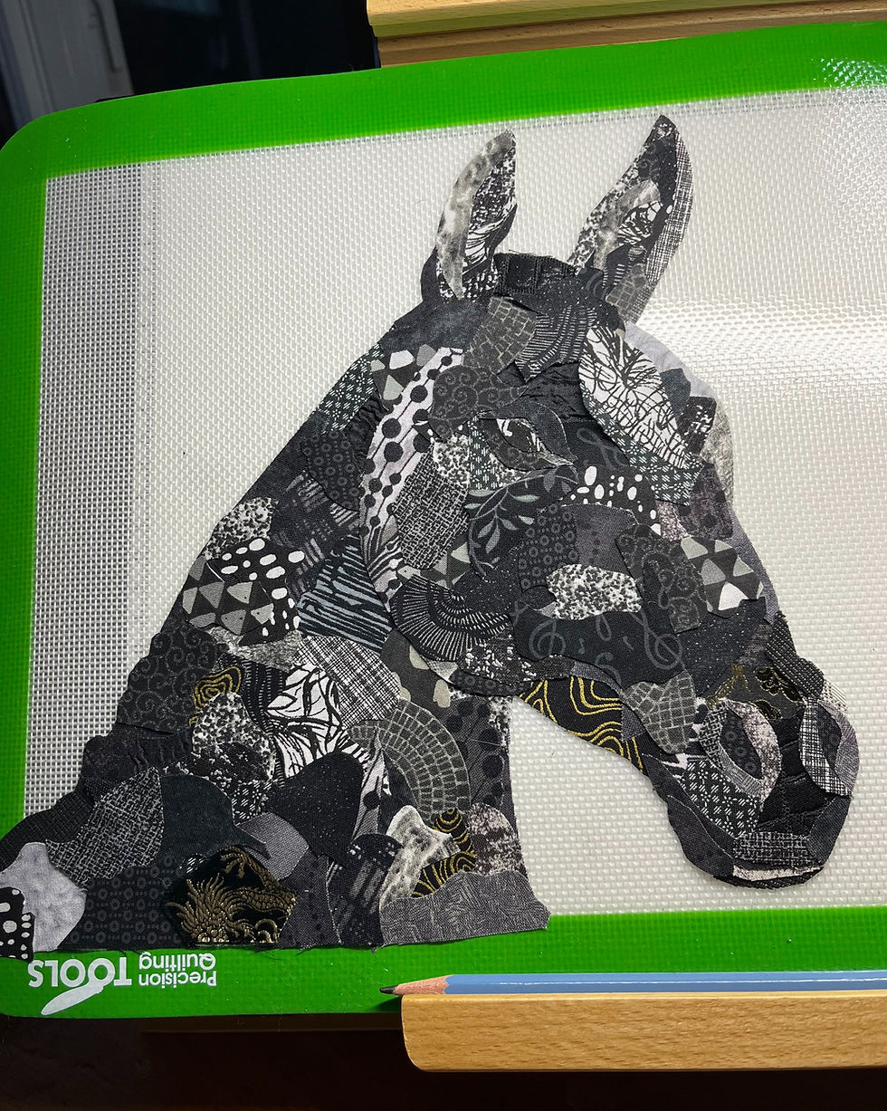 Thumbnail: Textile collage art of black Horse before mane created