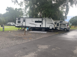Spacious full-hookup RV site with 30/50-amp service at Rivers Edge RV Park