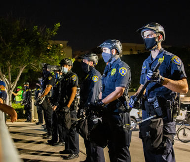 San Diego Police officers guard the San Diego Police Department 