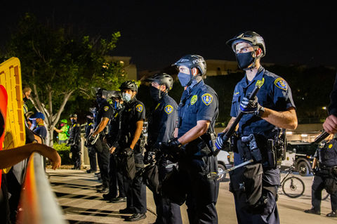 San Diego Police officers guard the San Diego Police Department 