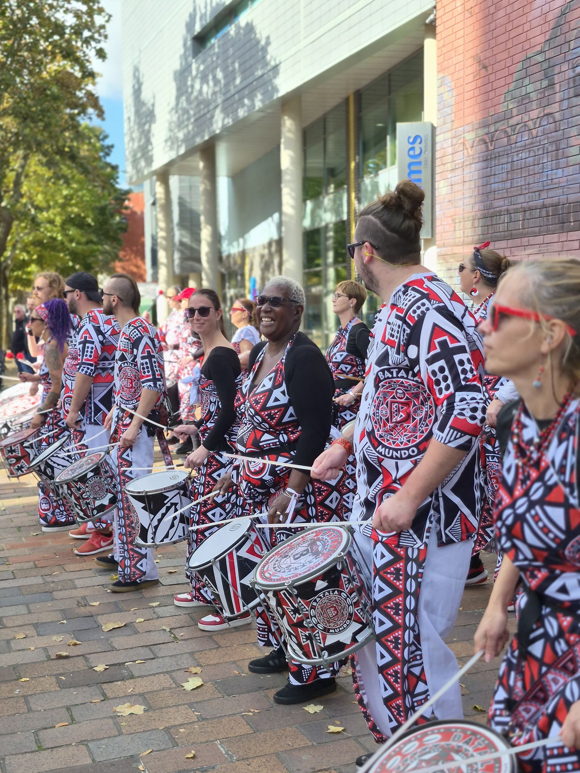 Drummers lined up along the pavement, sticks at the ready, bringing some Batala energy to the runners.