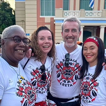 A group photo of four Batala London members who attended Batala Creta 10th Anniversary.