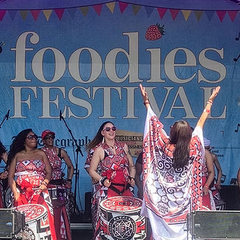 Batala London performing on stage at the Syon Park Foodies Festival.