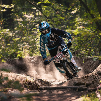 person riding on motocross in the forrest