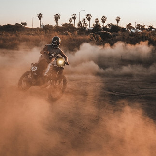 person riding on motocross in the hills