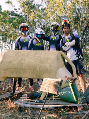 people in morotbike clothes with a ceramic sculpture