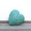 Miniatura: shiny turquoise Ceramic Heart Pebble with a pattern on a white backgroud front view