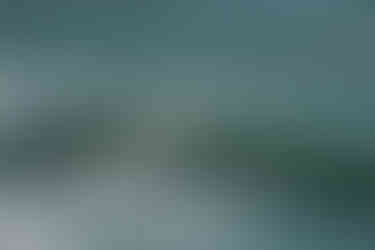 surfer in a dark wetsuit on a wave