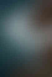 a photo of waves crashing the cliffs taken from the top