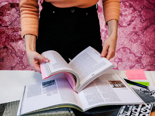 A woman gathering inspiration for her social media feed for Spill Social