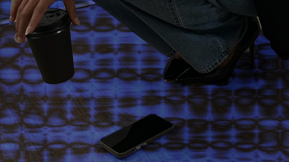 A desk with a laptop, smartphone, notepad, and a cup of coffee, surrounded by digital icons representing social media management tools and apps, symbolizing a streamlined social media tech stack for small business.