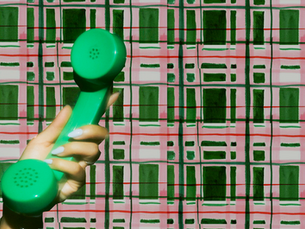 Person holding a smartphone representing owned media channels and email list marketing strategy for small business owners