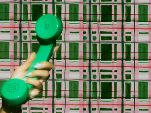 Person holding a smartphone representing owned media channels and email list marketing strategy for small business owners