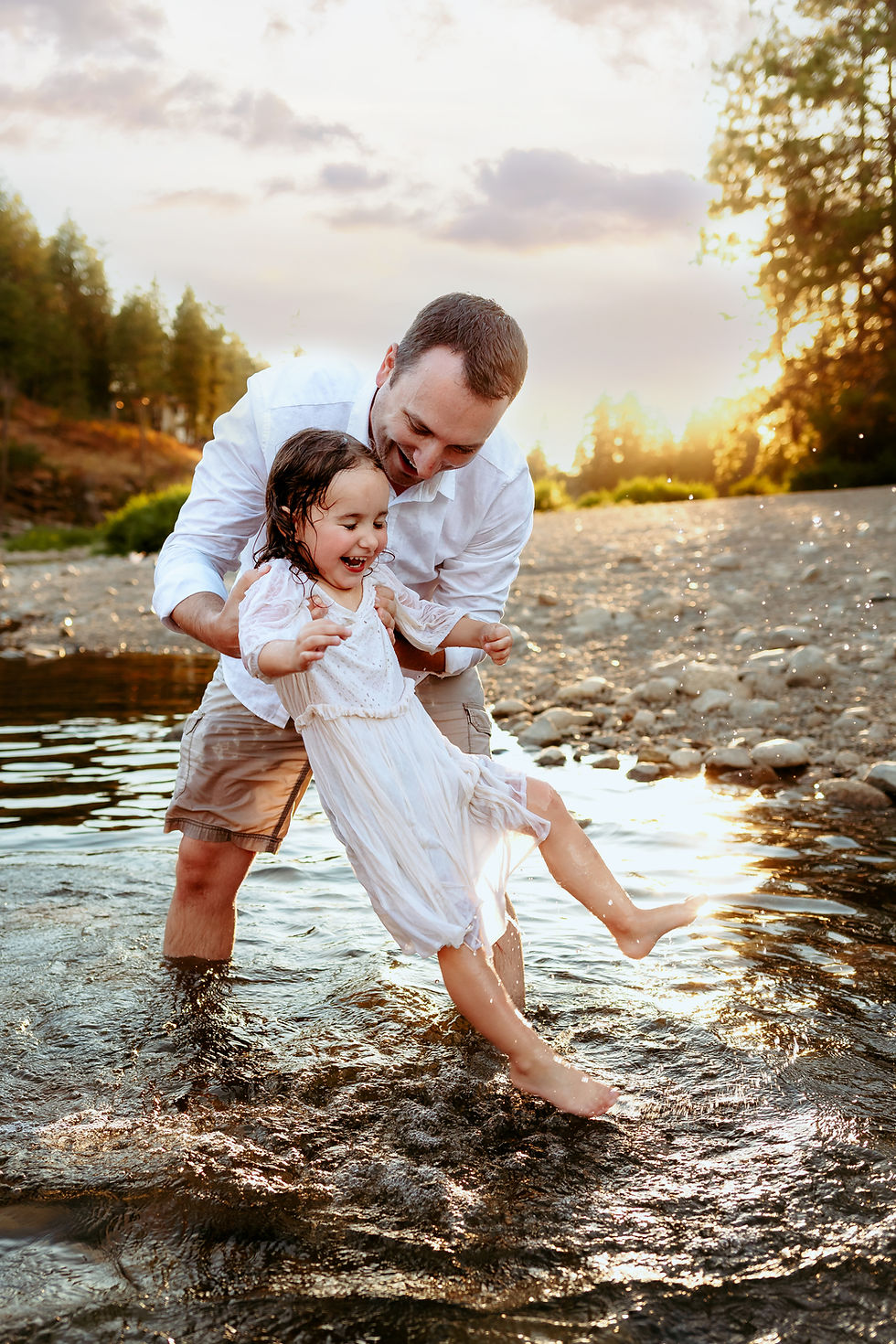 Eye-level view of a sunlit park bench surrounded by autumn leaves