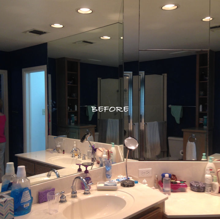 Extended vanity with knee space, marble countertops, undermount sinks, beveled glass mirrors, shutters, large formal floor tile, gray and white master bathroom, open shelving, hickory cabinetry. 