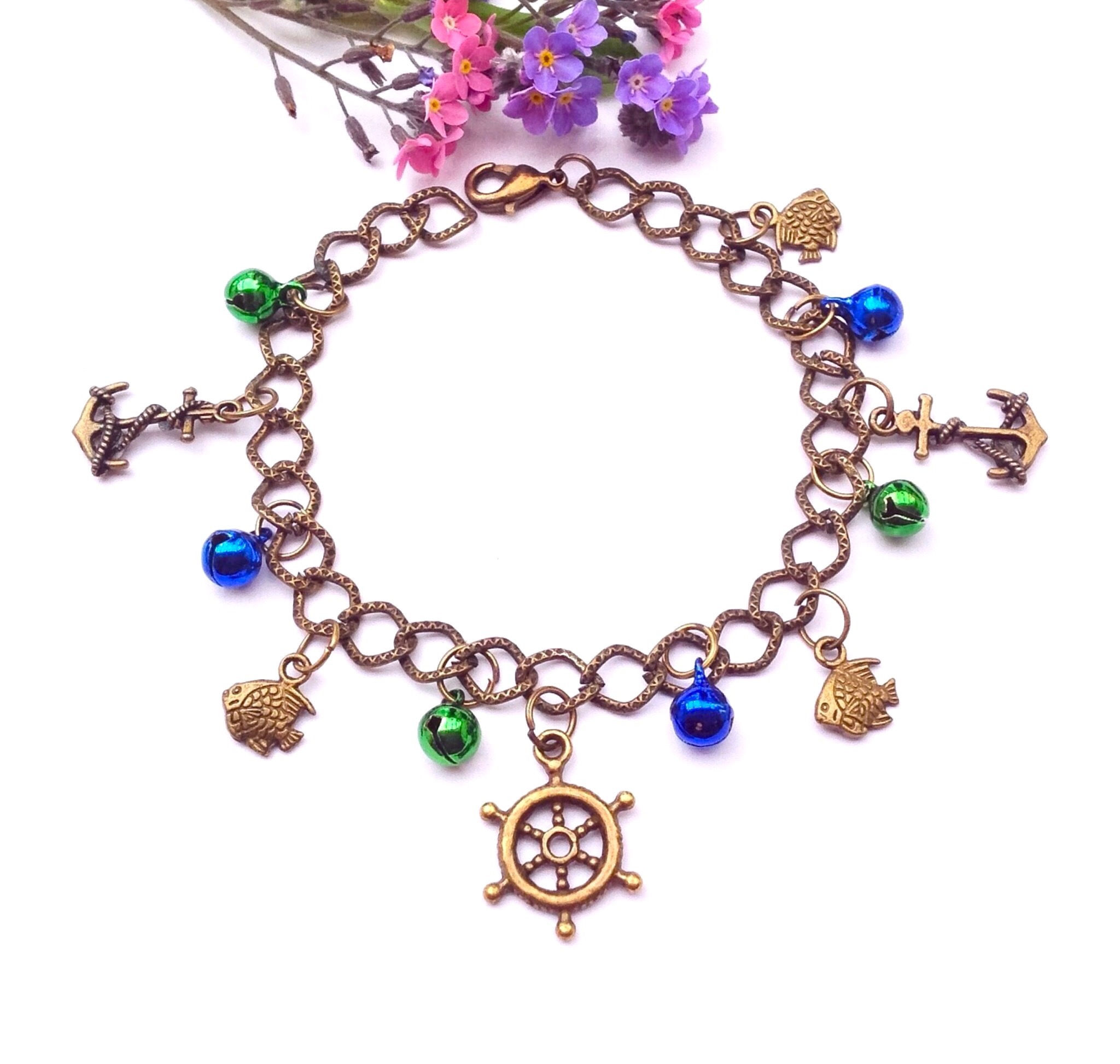 Bracelet chaîne marin Ancre Bateau Roue de gouvernail cloches multicolore Taille max.20cm.