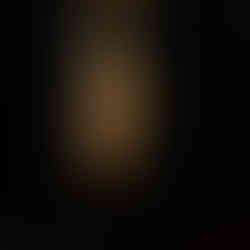 I turned the camera toward an isolated architectural curve - a glowing, winding stone spiral stairc