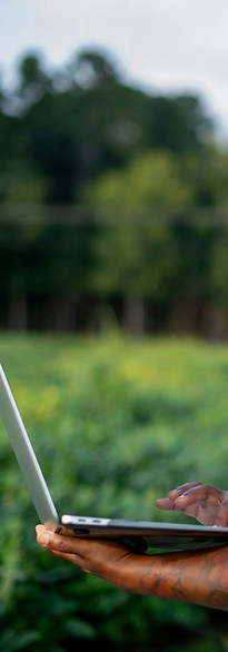 Woman using a laptop in a field_edited.j