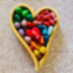 Grimms rainbow heart filled with Grapat mandala pieces for children's play idea