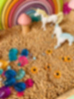 Unicorn small world play tray for kids using loose parts - gem and jewels and chickpeas