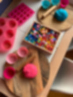 Playdough play idea for kids with playdough, silicone cupcake cases and muffin trays. Pretend gems and jewels in a tray for loose parts play.