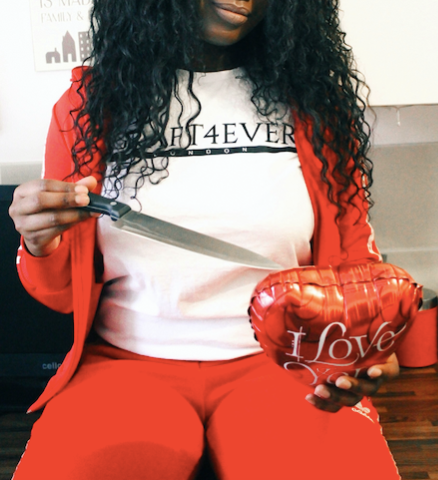blogger cutting through heart balloon