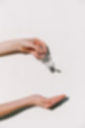 person-holding-hand-sanitizer-3962332.jp