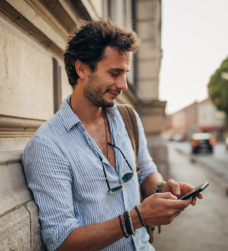 Tourist in street with phone on Tourlist