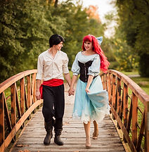 Ariel and Prince Eric smiling at one another.