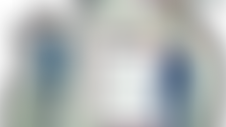 Two people in front of a survey with question marks around them