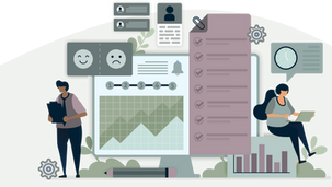 Two people working with charts and checklists on a computer screen. One writes on a clipboard, the other types on a laptop.